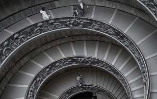 Downward perspective view of spiraling staircase